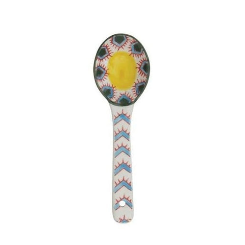 A hand painted ceramic spoon on a white background.
