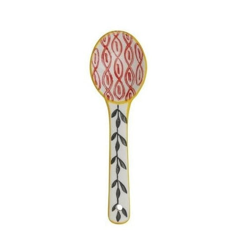 A hand painted ceramic spoon on a white background.