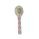 A hand painted ceramic spoon on a white background.