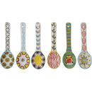 Six hand painted ceramic spoons on a white background.