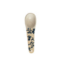 A hand-painted spoon with floral pattern on the handle.