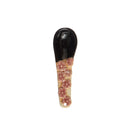 A hand-painted spoon with floral pattern on the handle.