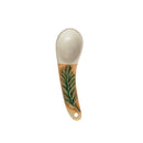 A hand-painted spoon with floral pattern on the handle.