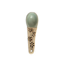 A hand-painted spoon with floral pattern on the handle.