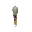 A hand-painted spoon with floral pattern on the handle.