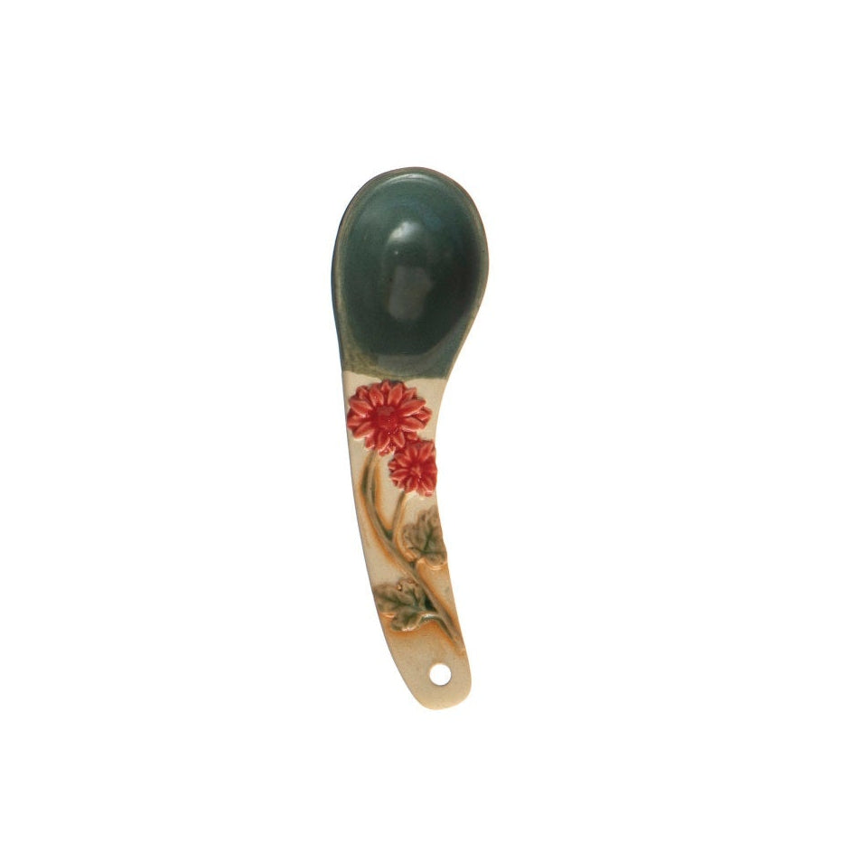 A hand-painted spoon with floral pattern on the handle.