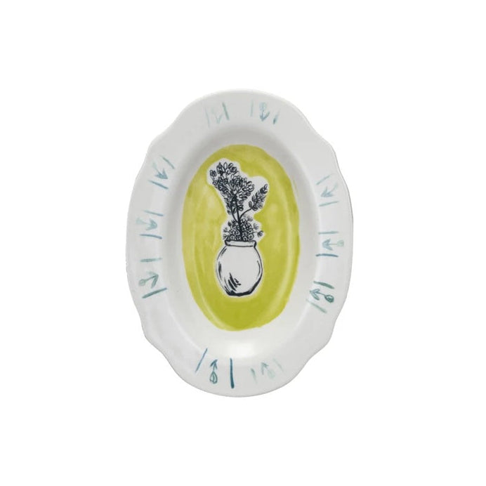 A hand painted stoneware plate with a yellow bottom and artist rendering of a vase with flowers in it.