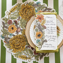 Decorative table setting with floral menu card on a striped tablecloth
