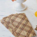 A set of brown plaid napkins on a marble surface.