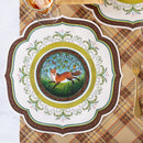 Decorative placemat with a fox design on a plaid tablecloth with a glass and fork.