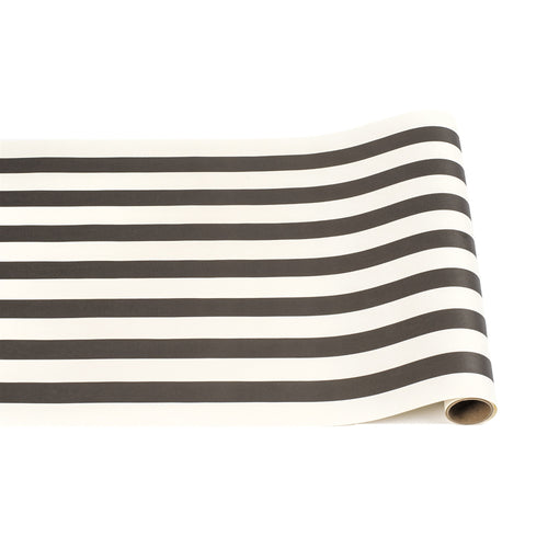A black and white striped paper table runner.