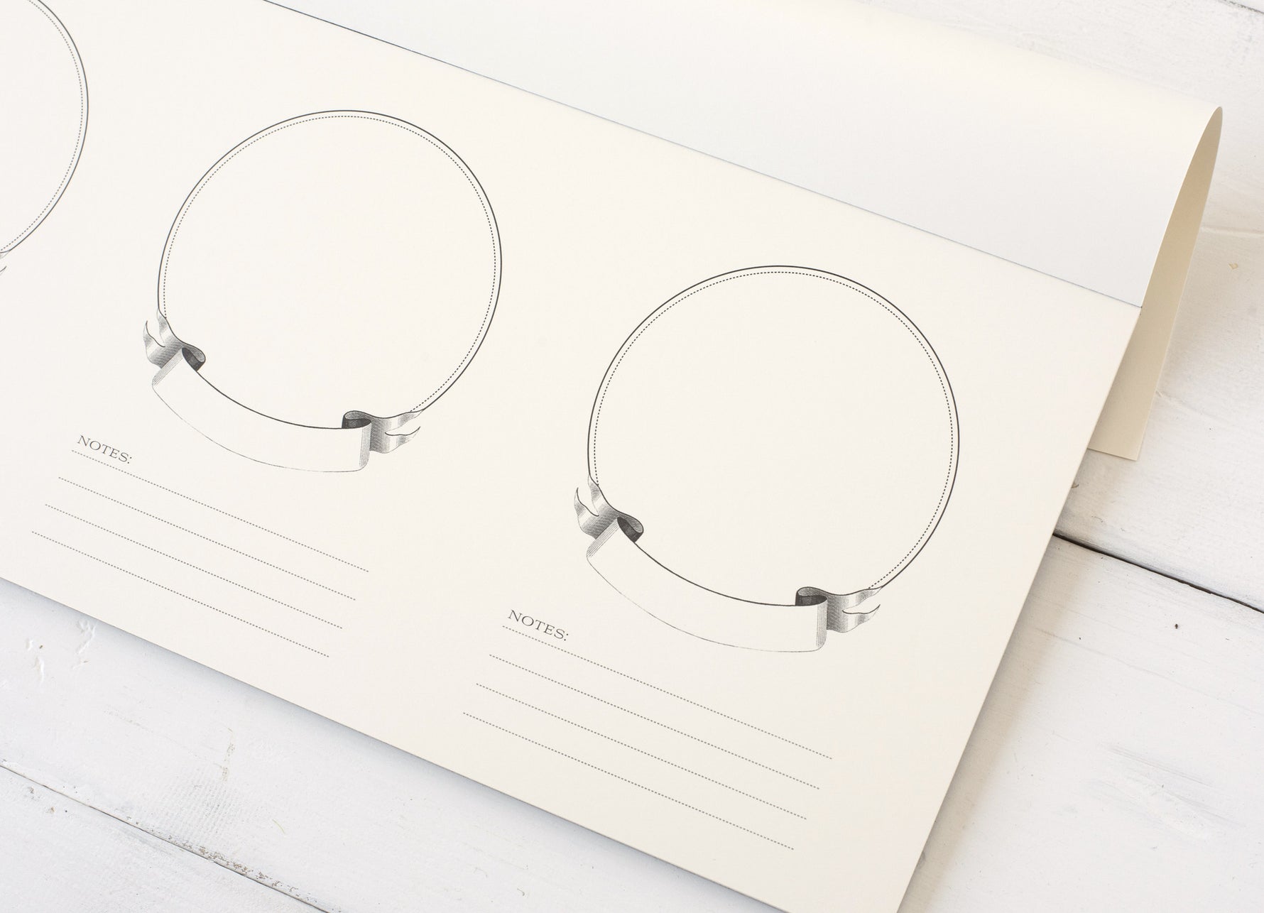 Set of tasting papers on a white surface.
