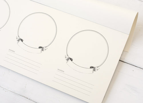 Set of tasting papers on a white surface.