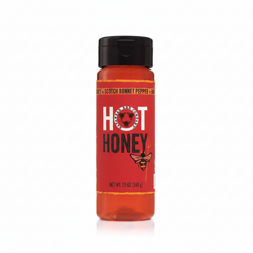 Bottle of hot honey with a red label and black cap on a white background