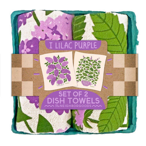 Set of 2 dish towels with floral patterns in packaging, featuring 'I Lilac Purple' and 'Mint' text.