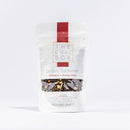 Tea bag from 'The Chai Box' with 'jaipur Summer' flavor on a white background
