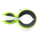 Green and gray silicone ring with a white object inside on a white background