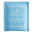 A single bag of Jasmine fragrant green tea by Harney & Sons in a soft blue color on a white background.