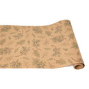 A beige kraft paper table runner with a juniper sprigs pattern, rolled up loosely.