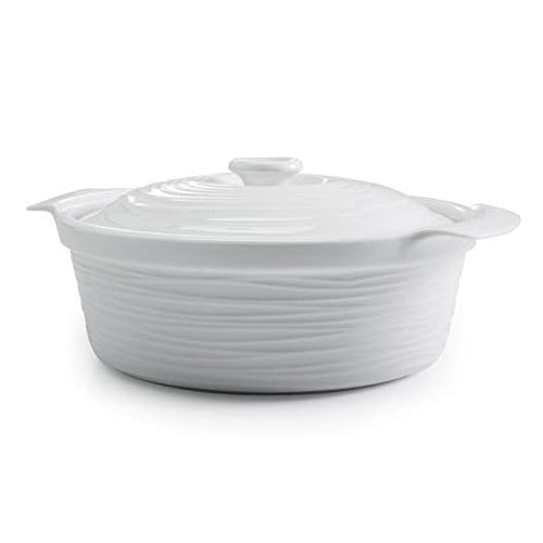 A white porcelain casserole dish with a lid on a white background.