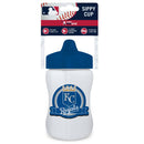 A white sippy cup with a blue lid and Kansas City Royals logo on the front. with red, white, and blue packaging at the top.