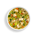 Bowl of soup with rice, vegetables, and tofu on a white background