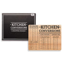 Wooden kitchen conversion board, with black packaging behind it on a white background.