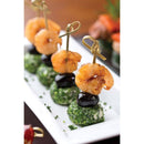 Platter of appetizers with shrimp and spinach balls on skewers.