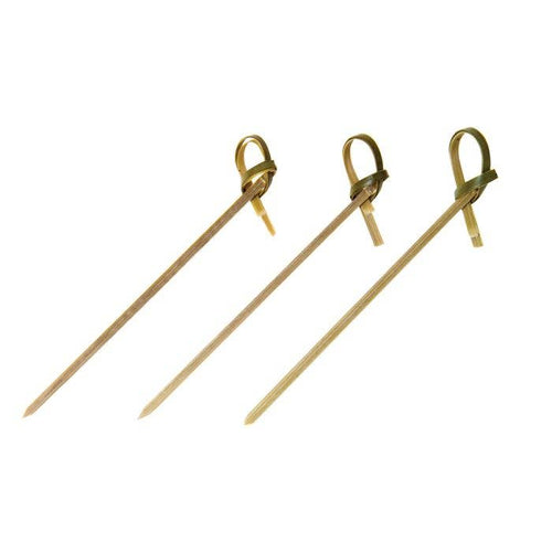 Three wooden skewers with loops on a white background