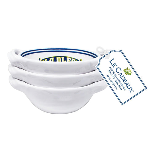 Set of white ceramic bowls with a Le Cadeaux tag on a white background