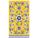 Decorative napkin with floral pattern against a yellow background on a white surface.
