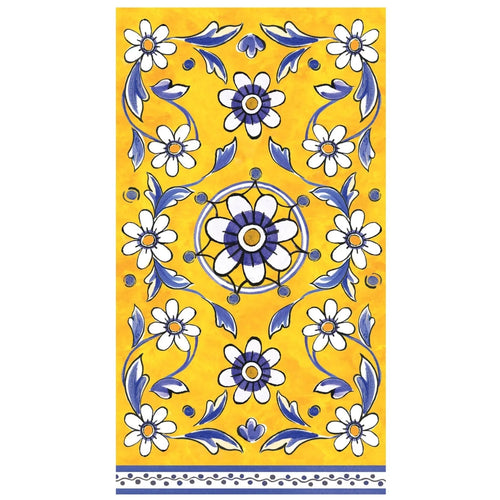 Decorative napkin with floral pattern against a yellow background on a white surface.