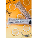 Two Shiver Sticks frozen treats on a yellow background with lemon slices and lavender bits.