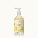 Bottle of Thymes Lemon Leaf hand soap on a white background
