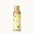 Lemon-scented home fragrance bottle with gold cap on a white background