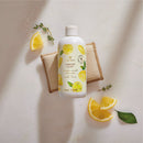 Lemon-themed bottle on a light background with lemon slices and leaves.