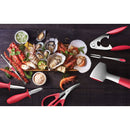 Assorted seafood platter with tools on a dark surface