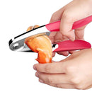 Person using a red and silver lobster cracker to open a lobster claw on a white background
