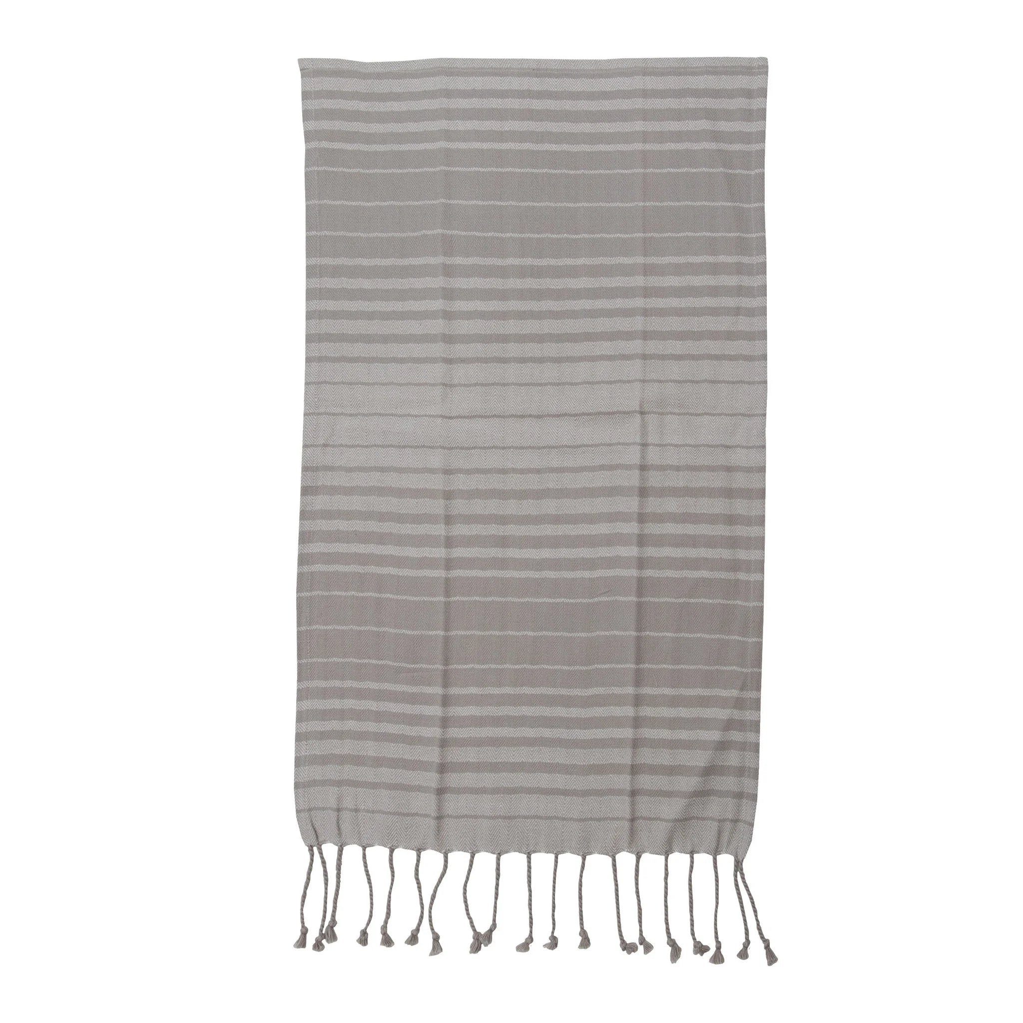 Striped towel with fringes on a white background