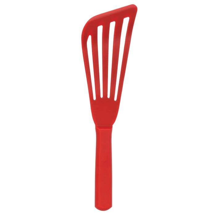 Red slotted fish spatula on a white background