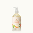 Thymes Mandarin Coriander hand wash bottle on a white background
