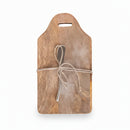 Mango cutting board with a canape knife tied together on a white background