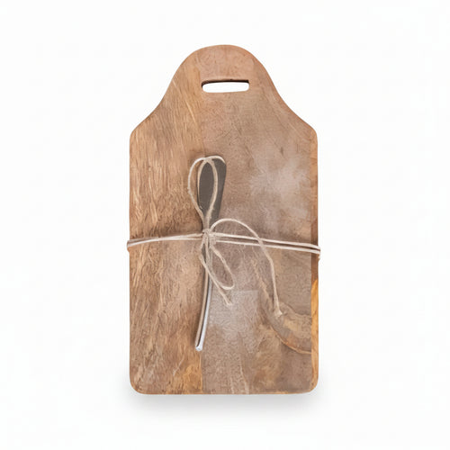 Mango cutting board with a canape knife tied together on a white background