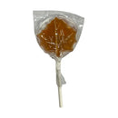 Maple syrup sucker in a clear plastic package on a white background