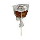 Maple syrup sucker in a clear plastic package with a label on a white background