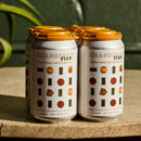 Four cans of Cranberry Fizz on a stone surface with a green background