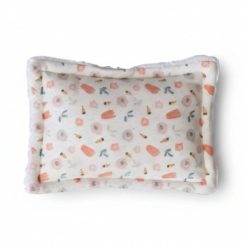 Floral patterned scrubby on a white background