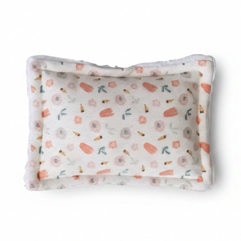 Floral patterned scrubby on a white background