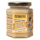 Jar of Messner Bee Farm creamed honey on a white background