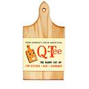 Wooden cutting board with Q-Tee on the package wrap on a white background